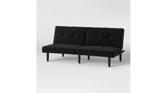 two black couches sitting next to each other on a white surface with no one in it