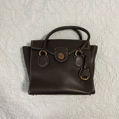 Brand New Without Tags Leather Hand Bag Mini Tote! Bought Around 2017 And Has Never Been Used, Stored In Its Dust Bag For All These Years. Originally Retailed For About $350. Can Be Worn As A Crossbody Or Handbag, Strap Included. Zipper Closure With 4 Brass Feet On The Bottom. Interior Is Pristine With Pocket Compartments! Ralph Lauren Satchel Shoulder Bag For Formal Occasions, Ralph Lauren Formal Satchel Shoulder Bag, Elegant Ralph Lauren Satchel For Everyday Use, Elegant Ralph Lauren Brown Bags, Elegant Brown Ralph Lauren Bags, Ralph Lauren Satchel Shoulder Bag With Gold-tone Hardware, Ralph Lauren Classic Shoulder Bag With Gold-tone Hardware, Classic Ralph Lauren Shoulder Bag With Gold-tone Hardware, Elegant Ralph Lauren Crossbody Shoulder Bag