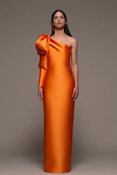 Description Orange Column, Long dress Loose, Long sleeves Open neckline One Sleeve Dry Clean Made in Spain SKU BIENTINA Sheath Gown, Column Skirt, Woman Suit Fashion, Wedding Attire Guest, Column Gown, Column Dress, Bow Knot, Wedding 2024, Mermaid Fashion