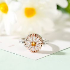 This photo ring is the best choice to make the memory eternal. Fashioned in sleek sterling silver, this ring features a charming daisy, and a shimmering round-cut stone is set at the center to complement the brilliance. With your own photo included, this beautiful piece will be more memorable. You can also wear it as your pendant to make your daisy-themed necklace dangling close to your heart.Carat Weight: 0.81 ctStone Size: 3,1.5,1.3 mmStone Type: Jeulia® StoneNumber of Stones: 28 Stone Shape: RoundStone Color: Citrine Yellow, Diamond WhiteWeight: 4.6 gWidth: 11.4 mmHeight: 5.9 mmThickness: 3.1 mmMaterial: 925 SilverPlating Color: Silver, Rose Gold White Flower Ring With Gemstone For Promise, White Gemstone Flower Ring For Promise, White Gemstone Flower Ring For Gift, Dainty Daisy Silver Jewelry, White Dainty Flower Ring For Promise, White Round Birth Flower Jewelry, White Gold Flower Jewelry With Halo Setting, White Gold Jewelry With Flower Halo Setting, White Gold Jewelry With Halo Setting In Flower Shape