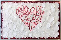 a white card with red writing on it that says, create in me a heart or god