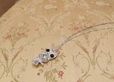 A lovely, long white metal necklace with an owl. It has dark blue eyes and a clear crystal body. From Montini. Dark Blue Eyes, Owl Gold Necklace, Owl Pendant Gold, Owl Necklace Silver, Metal Necklace, Owl Necklace, Scottie Dog, Metal Pendant, Stainless Steel Necklace