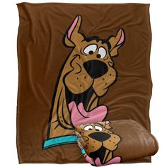 the scooby blanket and pillow set is brown with a cartoon dog on it