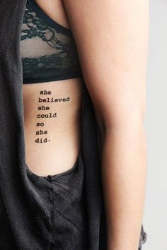 the back of a woman's stomach with an inscription on it that reads, nice quote tattoo on rib cage