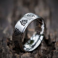 an image of a wedding ring with celtic symbols on the inside and inlays