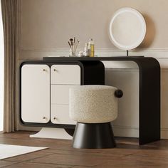 a black and white desk with a stool next to it