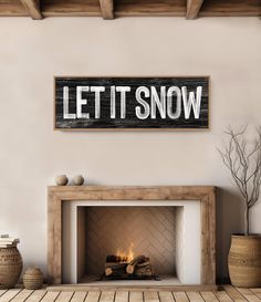 a fireplace with a sign that says let it snow