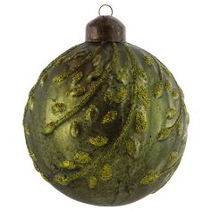 a green ornament with gold glitters on it