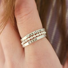 -the Blake- Make your heart smile with the Blake Ring Set. This personalized gift includes two name rings and a beaded ring. - Two custom engraved name rings - Understated 2mm beaded band, perfect for stacking - Available in Fine and Sterling Silver or 14K Gold Filled These dainty rings are as beautiful. Their slim silhouette features the engraved names of your nearest and dearest, keeping them close always. Please read our policies before purchase. Connect with us on social media @ShopGoingGolden Stackable Name Rings, Ring Set Silver, Set Rings, Dainty Rings, Beaded Ring, Name Rings, Beaded Rings, Dainty Ring, Gifts For New Moms