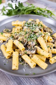 pasta with mushrooms and parmesan cheese on a plate