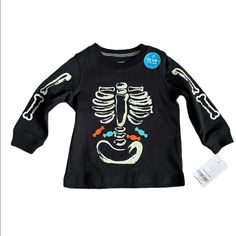 Nwt Size 9 Months Carters Black Long Sleeve Halloween Skeleton Shirt With Candy. D1 Playful Black T-shirt For Fall, Playful T-shirt For Fall Playtime, Playful T-shirt For Playtime In Fall, Black Tops With Cartoon Print For Playtime, Black Cartoon Print Tops For Playtime, Playful Black Tops For Playtime, Unisex Black Tops With Skull Print, Playful Black Fitted Tops, Playful Fitted Black Tops