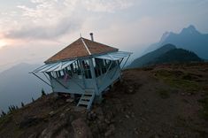 a small house on top of a mountain