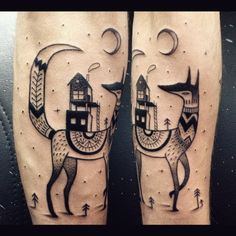 two legs with tattoos on them that have animals and houses in the shape of letters