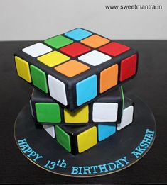 a birthday cake made to look like a rubik cube