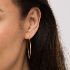 Achieve an effortless yet chic look with these classic 14K gold hoop earrings - a must-have fashion staple for your growing jewelry collection. Created in 14K gold Each earring showcases a simple yet bold 40.0mm-wide tubular hoop. These earrings secure with latch backs. Classic 14k Gold Filled Hoop Earrings For Everyday Luxury, Classic Yellow Gold Hoop Earrings For Everyday Elegance, Classic Hoop Earrings For Everyday Elegance, Classic Rose Gold Hoop Earrings, Classic Round Hoop Earrings In 14k Gold Filled, Minimalist 14k Gold Filled Hoop Earrings For Formal Occasions, Classic 14k Gold Filled Round Hoop Earrings, Classic Round 14k Gold Filled Hoop Earrings, Classic Hypoallergenic Hoop Earrings For Everyday