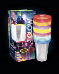 a stack of plastic cups sitting in front of a box with its lid open and the packaging on it