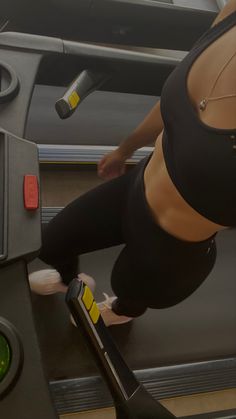 a woman on a treadmill in a gym