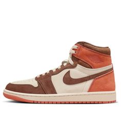 The Air Jordan 1 Retro High OG is a captivating addition to the sneaker world. Its colorway, featuring Dusted Clay, Cacao Wow, and Burnt Sunrise, evokes a warm and earthy vibe. The vibrant burnt orange Air Jordan Wings logo and tongue branding add a striking contrast. Brown Cushioned Sneakers For Athleisure, Brown Athleisure Sneakers With Cushioned Footbed, Breathable Brown Sneakers For Streetwear, Brown Athleisure Sneakers For Streetwear, Brown Breathable Sneakers For Light Sports, Breathable Brown Sports Sneakers, Breathable Brown Sneakers For Light Sports, Jordan Wings, Wmns Air Jordan 1