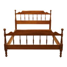 a wooden bed frame with posts and headboard