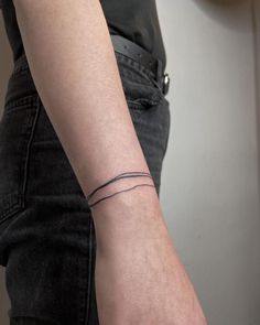 a person with a small tattoo on their arm