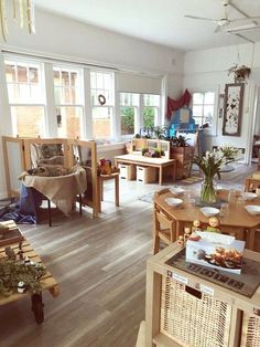 a living room filled with furniture and lots of windows