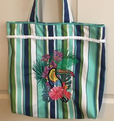 Colorful toucan tote bag. Fully lined with two inside pockets. Perfect for every day use of that special trip you plan. Size is 17x17. Tropical Style Tote Beach Bag For Everyday Use, Tropical Rectangular Bags For Daily Use, Tropical Style Tote Bag For Daily Use, Green Tropical Bags For Daily Use, Tropical Multicolor Tote Bag, Green Tropical Bags, Tropical Multicolor Tote Shoulder Bag, Tropical Style Multicolor Tote Shoulder Bag, Tropical Multicolor Bag For Everyday Use