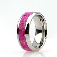 Titanium Cremation Ring inlaid with Opal # 09 - Magenta. https://cremationjewelers.com/ Crushed Opal offers a unique addition to pet memorial jewelry, allowing you to keep your beloved four-legged loved one close to you. All Cremation Jewelry, Memorial Jewelry, Ash Rings, Cremate Rings, Pendants and Urn Jewelry made with 2-legged (human) loved one's ashes, must be ordered directly from my personal site due to Etsy policies, see www.CremationCreations.net RING WIDTH SIZES AVAILABLE: 4 mm, 6 mm, a Pink Ring With Polished Finish, Pink Wedding Rings With Polished Finish, Cremation Ring, Ashes Ring, Pet Memorial Jewelry, Jewelry Opal, Urn Jewelry, Crushed Stone, Opal Color