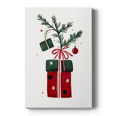 a christmas present wrapped in red and green wrapping paper with a pine branch sticking out of it