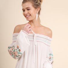 Umgee Boho Off-White Embroidered Off Shoulder Tunic Top Beautifully Detailed Embroidered Bohemian Top By Umgee Usa, This Fashion Statement Top Features A Beautifully Smocked Off The Shoulder Neckline. Gorgeous Embroidered Sleeve Details Material Is A Light And Gauzy Soft Cotton Blend. Hand Wash Cold Water; Hang To Dry Model Is 5' 8" Wearing A Small; See Chart For Measurements Spring Vacation Embroidered Top With Embroidered Hem, White Bohemian Peasant Top With Smocked Bodice, White Bohemian Top With Smocked Bodice, White Blouse With Smocked Cuffs For Brunch, White Blouse With Smocked Bodice For Vacation, Spring Cream Top With Embroidered Hem, Spring Vacation Embroidered Top With Embroidered Neckline, Cream Tops With Embroidered Hem For Spring, Cream Top With Embroidered Hem For Spring