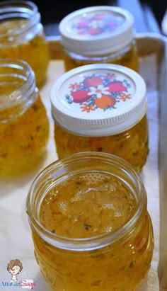 several jars filled with food sitting on top of a table