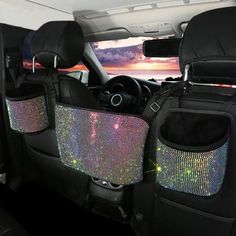 the interior of a car with colorful lights and black leather upholstered seat covers