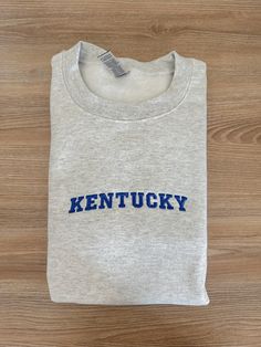 If you want a custom order or have any questions, please message me! -Kentucky embroidered crewneck -50/50 cotton/polyester -Unisex sizing: fits true to size. Order one size up for a looser fit. Fan Apparel Cotton Sweatshirt With Embroidered Graphics, College Crew T-shirt With Embroidered Text, Custom Embroidered Cotton Sweatshirt For College, Custom Embroidery Crew T-shirt For College, Custom Embroidered Crew T-shirt For College, Crew Neck T-shirt With Custom Embroidery, School Spirit Cotton Sweatshirt With Embroidered Text, College Crew T-shirt With Custom Embroidery, Custom Embroidery Crew Neck T-shirt For College