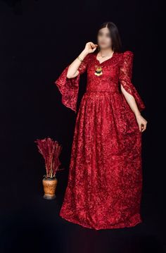 This stunning wine red Kurdish dress, featuring intricate floral embroidery and shimmering sequins, is the perfect choice for weddings, cultural events, and formal gatherings. The dress is designed with a flattering silhouette and detailed craftsmanship, showcasing the beauty of traditional Kurdish attire with a modern twist. The lace sleeves and delicate embellishments add an extra touch of elegance. *Material: Chiffon with sequins and floral embroidery *Size: Available in small size  *Care Ins Traditional V-neck Embroidered Wedding Dress, Festive V-neck Wedding Dress, Traditional V-neck Sequin Dress, Formal Maxi Evening Dress For Eid, Festive Lace Gown, Formal Party Wear Gown For Eid, Floral Embroidered V-neck Lace Wedding Dress, Wedding V-neck Lace Dress With Floral Embroidery, Traditional Maxi-length Formal Gown