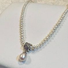 Elevate your style with this stunning freshwater pearl costume necklace. The perfect accessory for any occasion, this necklace is designed to add a touch of elegance and sophistication to your outfit. With its delicate and timeless design, it is sure to become a staple in your jewelry collection. Crafted with high-quality materials, this necklace is durable and long-lasting. Its beautiful pearls are sure to catch the eye and make a statement. Perfect for any fashion-forward individual, this necklace is a must-have addition to your jewelry collection. Reposhing this item I purchased from @mediamagician. Loved it, but ready to rotate for something new. Questions? Leave a comment below! Elegant White Briolette Pearl Necklace, Elegant Beaded Pearl Rhinestone Necklace, Elegant Pearl Rhinestone Necklace, Elegant Pearl White Shell-shaped Necklace, Pearl White Shell-shaped Necklace With Pearl Drop, Costume Necklaces, Fresh Water, Freshwater Pearls, Timeless Design