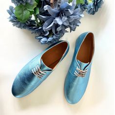 ❣ PRODUCT DESCRIPTION Stand out from the crowd with the eye-catching metallic finish of these Oxford shoes. The rich aqua-blue shade adds a pop of color to any outfit, ensuring you make a statement with every step. Classic yet contemporary, these Oxford shoes feature a sleek silhouette with a round toe and short heel.  The timeless design exudes sophistication, making them suitable for casual and formal occasions. Pair them with tailored pants for a sophisticated workplace appearance, dress them Blue Leather Shoes With Round Toe For Summer, Blue Leather Round Toe Shoes For Summer, Blue Leather Party Shoes, Blue Closed Toe Leather Shoes For Spring, Blue Leather Shoes With Leather Sole For Spring, Spring Blue Closed Toe Leather Shoes, Blue Leather Party Shoes With Round Toe, Blue Leather Shoes With Round Toe For Party, Blue Leather Shoes With Flat Heel