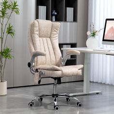 an office chair sitting in front of a desk with a computer monitor on top of it