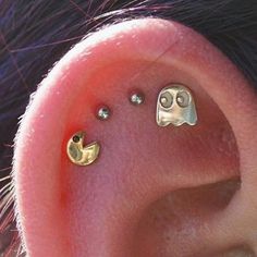 an ear with two little smiley faces on it