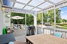 an outdoor patio with tables and chairs