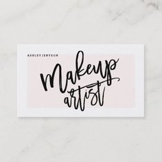 makeup artist business card with the words makeup artist in black ink on a white background