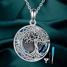 "Discover our meticulously handcrafted 925 Sterling Silver Ashes Pendant adorned with Natural Abalone Shells and embellished with Swarovski crystals. This exquisite piece is a testament to the loving memories we hold dear. Engraved with the words \"Forever in My Heart,\" it serves as a beautiful tribute to those we cherish. The Tree of Life featured on the pendant symbolizes hope, heritage, and heartfelt wishes, ensuring that our loved ones remain a part of us, always. The necklace comes complete with an adjustable chain, measuring 20 inches in length with an additional 2-inch extender, making a total of 56 cm. The pendant itself weighs approximately 8 grams, with dimensions of 1.1 inches in height (28 mm) and 0.79 inches in width (20 mm). The lobster-claw closure ensures a secure and comf Artisan Silver Necklace With Birthstone, Stamped 925 Round Pendant Necklace For Keepsake, Artisan Personalized Silver Necklace, Personalized Artisan Silver Necklace, Artisan Silver Birthstone Necklace, Stamped 925 Round Pendant Keepsake Jewelry, Personalized Silver Artisan Necklace, Tree Of Life Jewelry For Jewelry Making, Sterling Silver Tree Of Life Jewelry For Anniversary