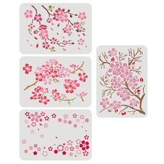 three stickers with pink flowers and leaves on them, one is in the shape of a tree