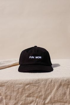 "Im not like a regular mom , I'm a fun mom." Intentionally Blank "Fun Mom" hat saying it all for you. cool mom One size. Adjustable back. Hand embroidered in LA. PIPE AND ROW Fun Black Cotton Baseball Cap, Black Fun Snapback Hat With Curved Brim, Fun Hats With Embroidered Logo One Size, Fun Hats With Embroidered Logo, Fun Embroidered Logo Hat One Size, Fun Embroidered Logo Baseball Cap, Fun Baseball Cap With Embroidered Logo, Fun Black Hat With Flat Brim, Fun Black Flat Brim Hat