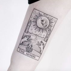 a tattoo on the arm of a person with a sun and moon above it,