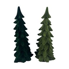 two green trees are standing next to each other on a white background and one is made out of felt