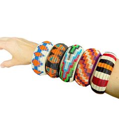 Our Werregue bracelets are handmade by Wounaan Indigenous women from fibers extracted from Werregue Palm Trees. Listing is for one colorful  bracelet with intricate woven pattern, These can be worn one at a time or together as a stackable set as is shown in the first picture. Care Instructions:  Do Not Wash. Rub them with a microfiber cloth. Our bracelets are made of Werregue palm fiber and dyed with leaves of plants , fruits  and flowers. MEASUREMENTS:  Due to its handmade nature, the size of the bracelets varies. PLEASE CHECK THE PICTURE WITH THE MEASUREMENTS OF THE DIAMETER OF EACH BRACELET  If you have any question don't hesitate in send me a message. Adjustable Handwoven Bracelets, Colorful Adjustable Traditional Bracelets, Traditional Adjustable Colorful Bracelets, Multicolor Festival Bangle Bracelet, Handwoven Beaded Bracelets For Beach, Handmade Multicolor Bangle, Friendship Woven Bracelets, Multicolor Hand Wrapped Bangle Bracelets, Multicolor Bohemian Cuff Bracelet As A Gift