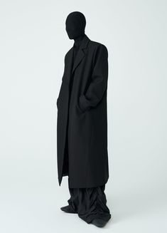 Discover the ultimate in style and comfort with The Shadow Overcoat. This unisex, loose-fitting overcoat features padded boxy shoulders and an oversized design. Made from a blend of wool, cotton, and polyester, it offers a minimal aesthetic without buttons. The wind-resistant material makes it perfect for autumn and winter. Available in black and in sizes Small to Extra Large. Size Chart: Size (CM) Length Sleeve Chest Shoulder Small 119 62.5 102 47 Medium 122 64 106 48 Large 125 65.5 110 49 Extr Oversized Solid Wool Coat For Business, Oversized Long Formal Outerwear, Oversized Wool Coat For Business, Oversized Long Outerwear For Formal Occasions, Oversized Long Sleeve Wool Coat For Business, Oversized Solid Wool Coat For Work, Oversized Long Wool Coat Single Breasted, Oversized Formal Outerwear, Oversized Solid Color Formal Outerwear