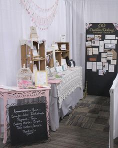 the tables are set up for an event with signs and pictures on them, along with other decorations