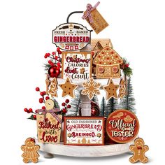 a christmas tree made out of gingerbreads and other holiday decorations on top of a table