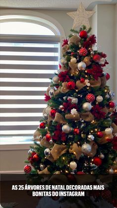 a christmas tree decorated with red, gold and silver ornaments