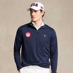 Part of the Polo Ralph Lauren Team USA Collection this pullover features an official logo patch of the U.S. Olympic Team as well as our signature embroidered Pony. Navy Top With Embroidered Logo For College, Winter Golf Tops With Long Sleeves, Classic Long Sleeve Tops With Embroidered Logo, Classic Long Sleeve Top With Embroidered Logo, Collegiate Long Sleeve Tops With Embroidered Logo, Classic Long Sleeve Golf Top, Ralph Lauren Long Sleeve Tops With Ribbed Cuffs, Sweatpants And Sweater, Olympic Team